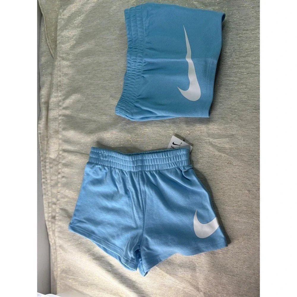 Two pairs of Nike baby blue short size 6